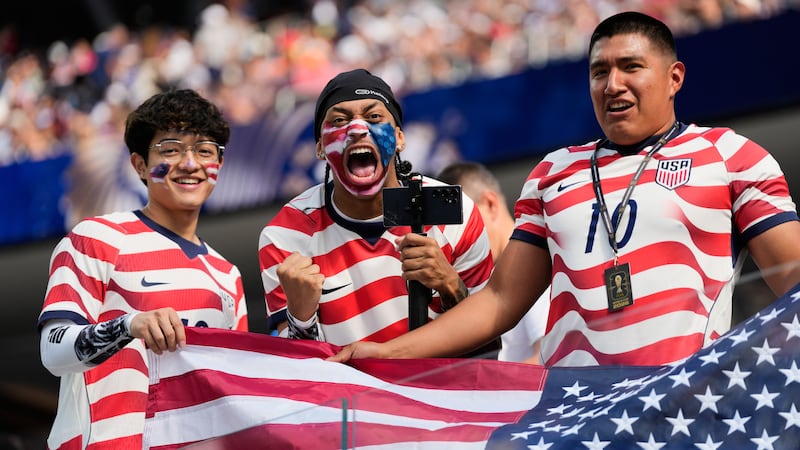 United States fans cheer prior to the World Cup Group D soccer match between the United States...