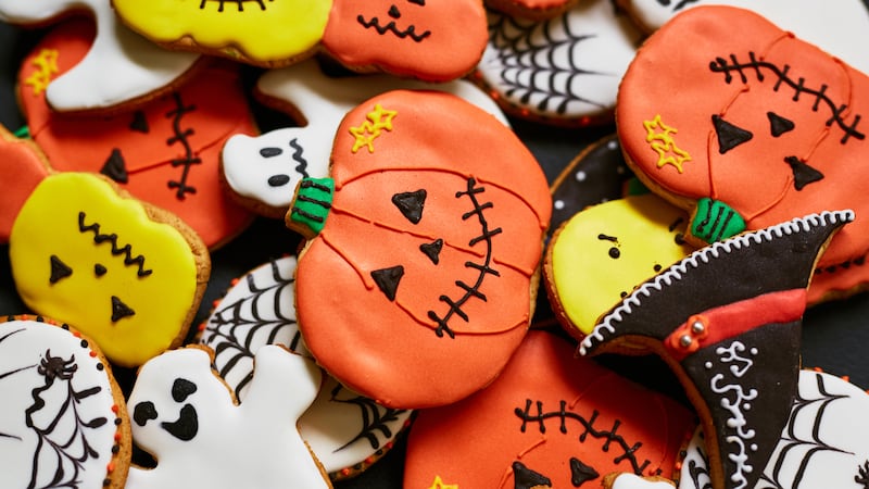 Trick-or-treat cookies in form of pumpkin, ghost and hat