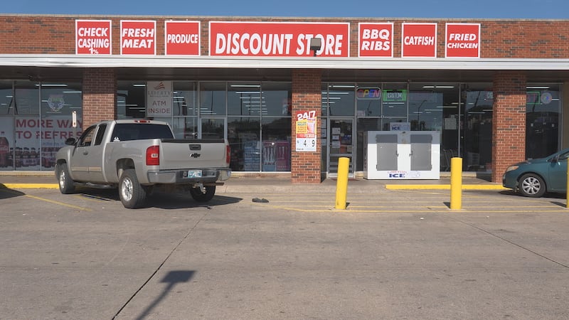 Surveillance video shows man taking items from Lawton store.