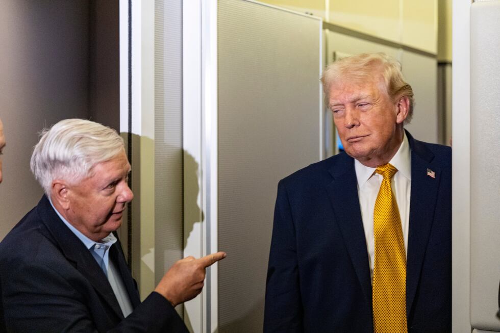 FILE - Sen. Lindsey Graham, R-S.C., left, gestures as President Donald Trump speaks with...