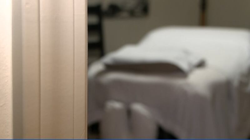 a massage parlor table that is a prepared for a client.