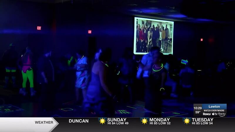 The theme for this year’s annual fundraiser was “80′s Glow Party.”